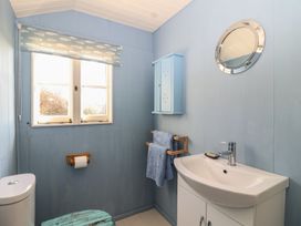 A bathroom with a sink and toilet at The Cabin in 