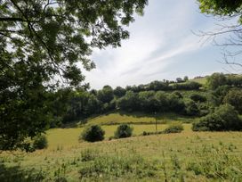 A view of hills and trees at Valley View Shepherd's Hut in South Molton
