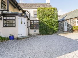 An outdoor area with a door and windows at The Farmhouse in Keswick