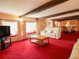 A living room with a sofa and coffee table at The Farmhouse in Keswick