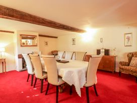 A dining room with a table and chairs at The Farmhouse in Keswick