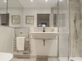 A bathroom with a sink and a shower at Wood Meadow in Helston