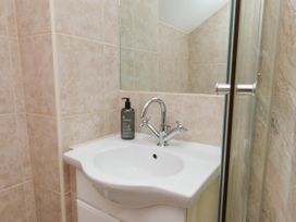 A bathroom with a sink and shower at Wren's Nest in Lealholm