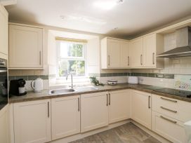 A kitchen with a sink and appliances at Bobbin Nook in 