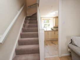 A staircase leading to a kitchen at Bobbin Nook