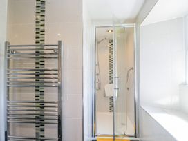 A bathroom with a shower and towel rail at Bobbin Nook