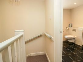 A staircase leading to a bathroom with a toilet at Bobbin Nook