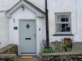 An entrance with a door and flowers at Bobbin Nook in Staveley