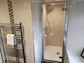 A shower with a towel rail in a bathroom at Bobbin Nook in Staveley