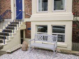 An outdoor area with a bench and stairs at The Hideaway in Whitby