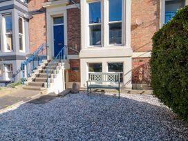 An outdoor area with steps, bench, and gravel at The Hideaway in Whitby