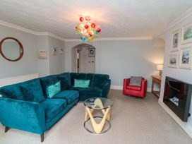 A living room with a sofa and coffee table at The Hideaway in Whitby