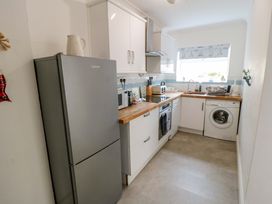 A kitchen with appliances and countertop at The Hideaway in Whitby