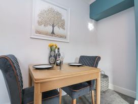 A dining room with a table and chairs at Cuckoo's Nest in Whitby