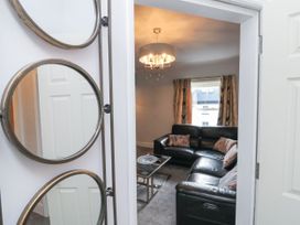 A living room with a sofa and coffee table at Cuckoo's Nest in Whitby