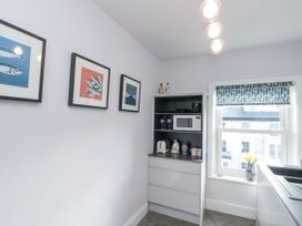 A kitchen with a microwave and kettle at Cuckoo's Nest in Whitby
