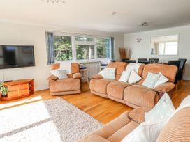 A living room with sofa and television at Flat 17 Golden Gates in Poole