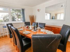 A dining room with a table set for a meal at Flat 17 Golden Gates in Poole