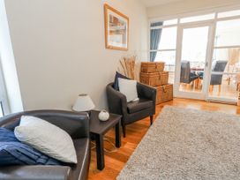 A living room with chairs and a coffee table at Flat 17 Golden Gates in Poole