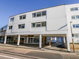 A building with shops and windows at Flat 17 Golden Gates in Poole