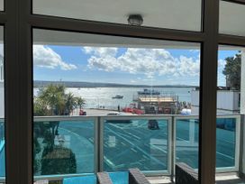A view from a balcony showcasing water and boats at Flat 17 Golden Gates Sandbanks