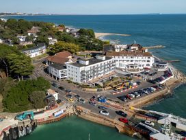 An aerial view of The Haven Hotel with beach and water in Sandbanks