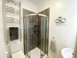 A bathroom featuring a shower and toilet at 2B Redcliffe in Torquay