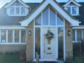 An entrance with a front door and windows at Seaview in Pakefield