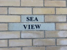 A brick wall with the name Sea View displayed at Seaview, Pakefield