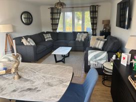 A living room with a sofa and coffee table at Seaview in Pakefield