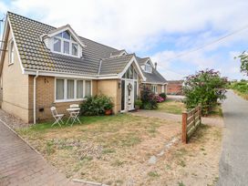 A house with a pathway and garden at Seaview in Pakefield