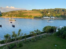 A view of water with boats and houses at 24 The Salcombe in Salcombe
