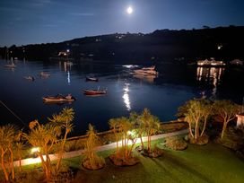 A view of boats on water and plants at 24 The Salcombe in Salcombe