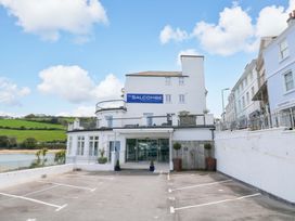 A building with a sign at The Salcombe in Salcombe