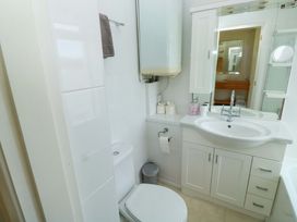 A bathroom with a sink and toilet at 24 The Salcombe in Salcombe