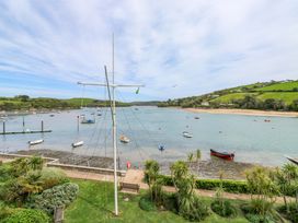 A view of a harbor with boats and hills at 24 The Salcombe in Salcombe