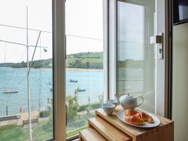 A view of the river with croissants and tea set at 24 The Salcombe Salcombe