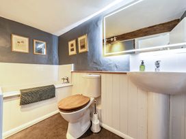 A bathroom with a bathtub and sink at Cutbush Farmhouse in Hingham