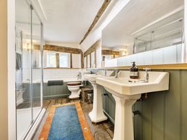 A bathroom with shower and bathtub at Cutbush Farmhouse in Hingham