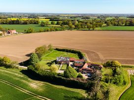 A farmhouse surrounded by fields at Cutbush Farmhouse in Hingham