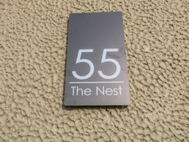A property sign displaying 55 The Nest in Grantham