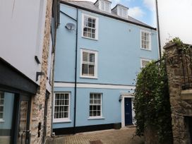 A residential building with blue exterior and windows at Dennings House, Mayors Avenue
