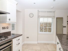 A kitchen with a countertop and appliances at Dennings House, Mayors Avenue Dartmouth