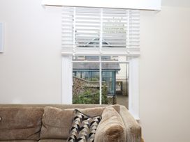 A living room with a window and couch at Dennings House, Mayors Avenue in Dartmouth