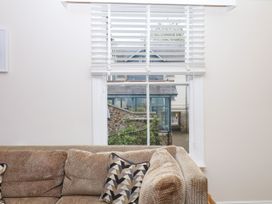 A living room with a window and sofa at Dennings House, Mayors Avenue in Dartmouth
