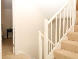 A staircase leading to a room with a door at Dennings House, Mayors Avenue Dartmoor