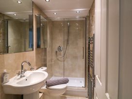A bathroom with a sink, toilet, and shower at Dennings House, Mayors Avenue in Dartmouth