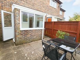 An outdoor area with a table and chairs at Amber House in Dorchester