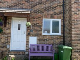 An entrance with a door and window at Amber House in Dorchester