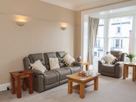A living room with a sofa and armchairs at Time Out in Whitby